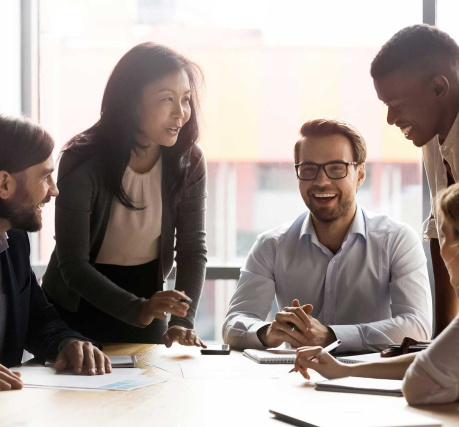 group of diverse employees around conference table