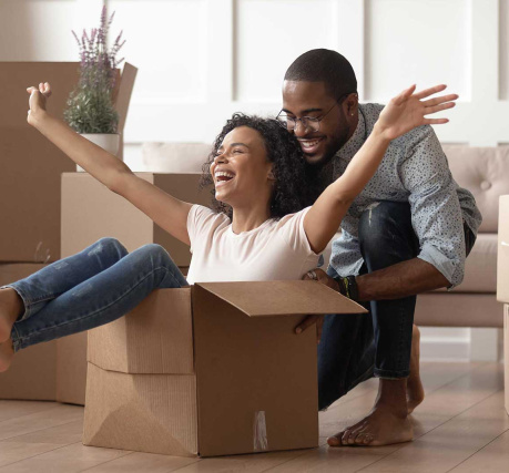 man and women with moving boxes