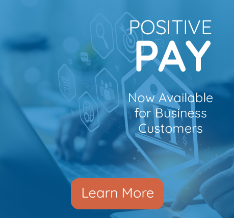 man using cell phone and computer for online banking with positive pay now available for business customers learn more button