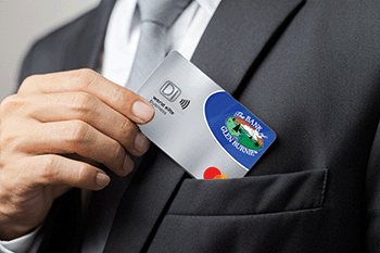 Man putting BOGB Business Credit Card in suit pocket