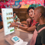customer placing order at restaurant using clover kiosk