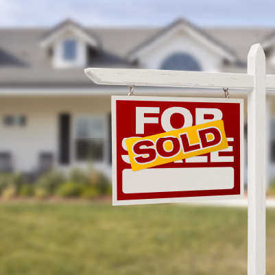 home with sold sign in yard