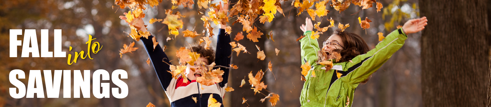 fall into savings text with children throwing fall leaves in the air